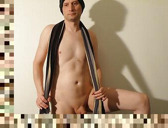 Kudoslong poses in a woollen had and scarf his body and and small penis are shaved smooth