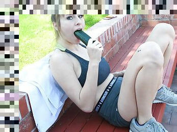 Hard oral fun in outdoor solo with a big cucumber in her cunt