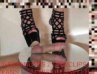 Mistress Elle grinds her slave's cock in her platform high heel sandals