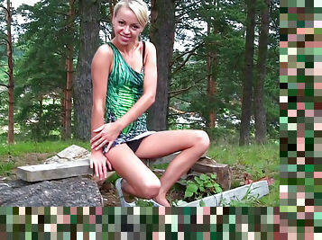 Cute blonde in the woods shows upskirt view
