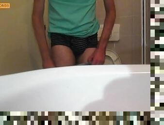 Hairy young man pisses in the toilet (different cameras)