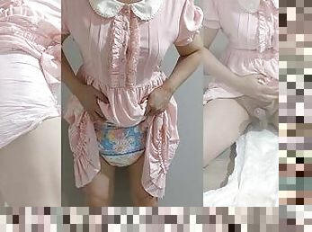 Crossdresser Wearing a Pink Dress and a Think Diaper 03