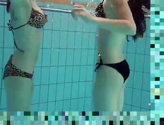 Mia and Petra undress each other in the pool