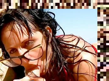 Raquel Abril, a cheating slut with brown hair, enjoys screams of pleasure while fucking on the beach