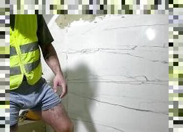 Horny construction worker install tile with bulge