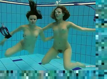 Both ladies in bikinis are hot stuff underwater