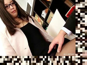 Japanese brunette with glasses and long hair giving a handjob