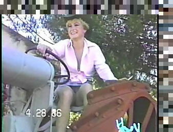 Cowgirl wife on the tractor smiles as she shows her cunt upskirt